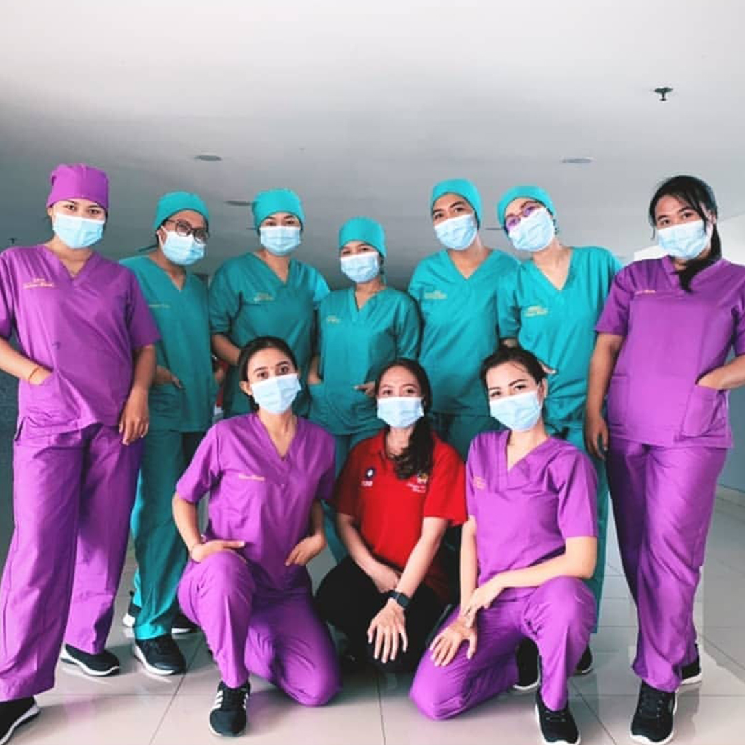 woman in red shirt wearing blue goggles