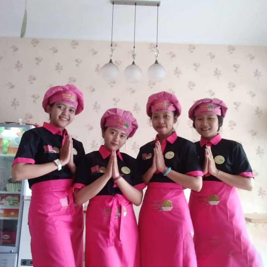 woman in red shirt wearing blue goggles