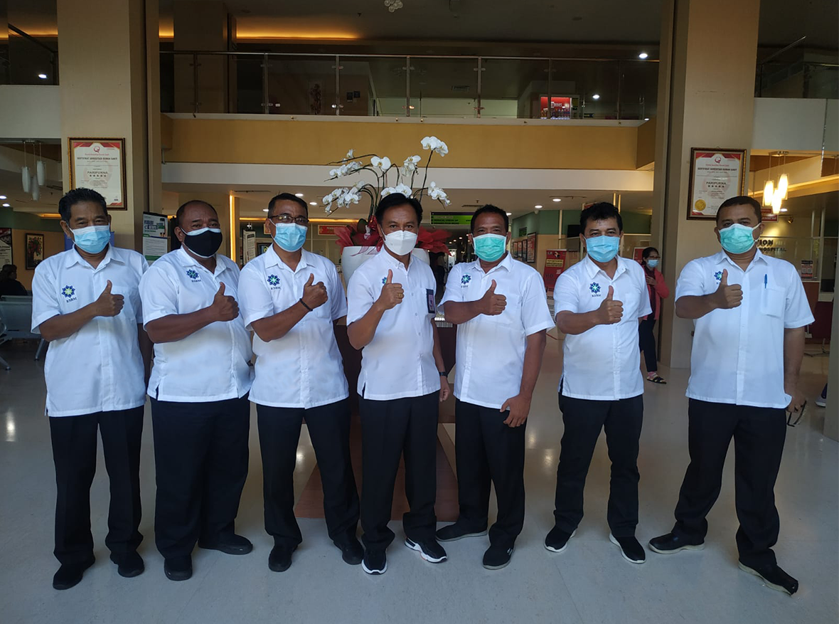 woman in red shirt wearing blue goggles